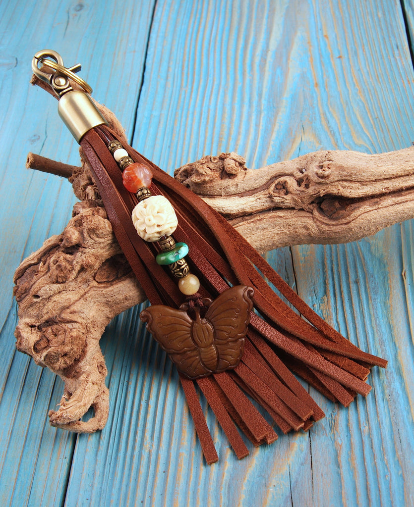 jade butterfly pendant on beaded brown leather tassel key fob bag charm with turquoise carnelian and carved bone beads