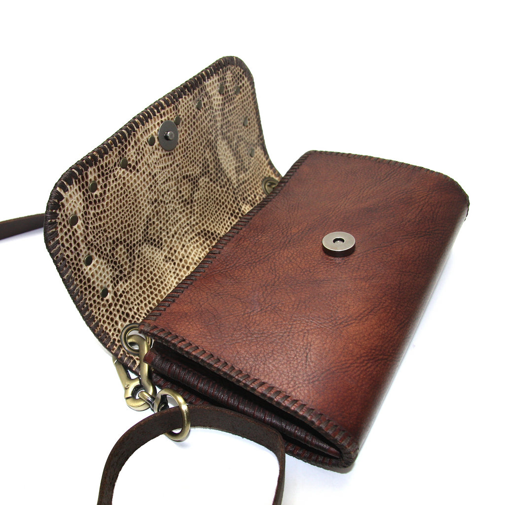 handmade brown leather cross body bag side view of tan snakeskin embossed lining