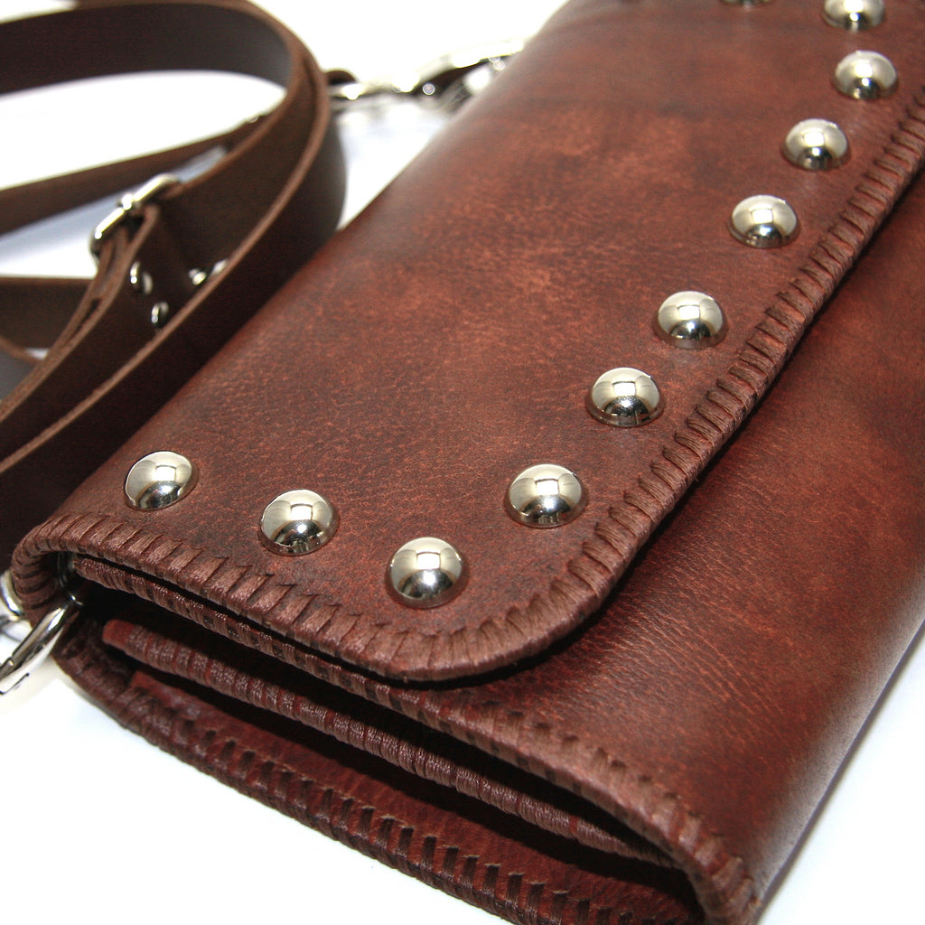 chic bohemian handmade brown leather studded crossbody bag with hand stitched detail on edges close up