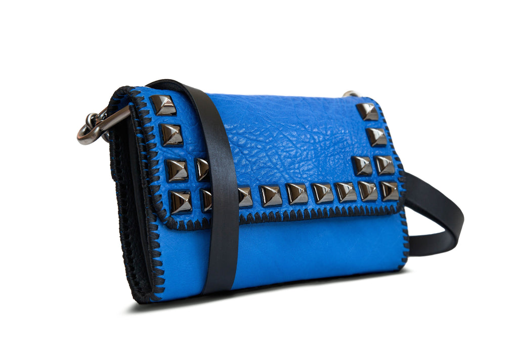 royal blue leather studded cross body handbag with long black strap side view
