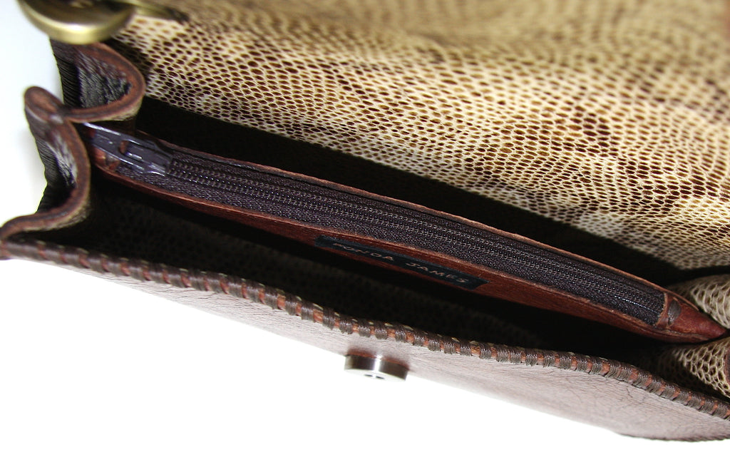 tan snake skin embossed leather lining in handmade brown leather cross body bag with zipper pocket in middle