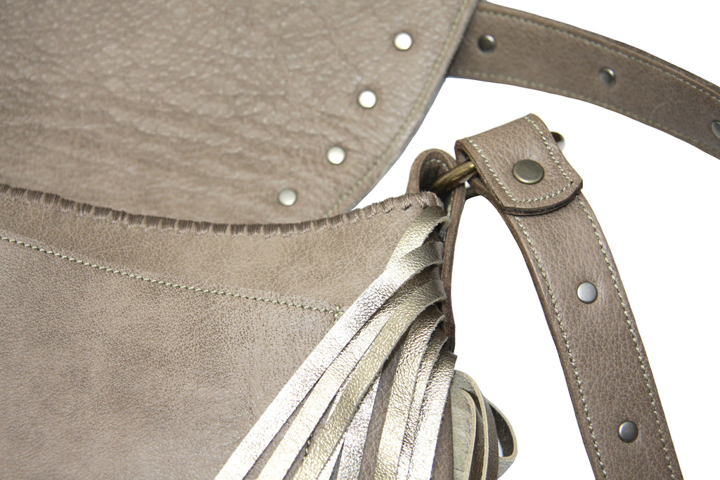 Bohemian cowgirl metallic handbag with beige leather and metallic fringe close  up purse open