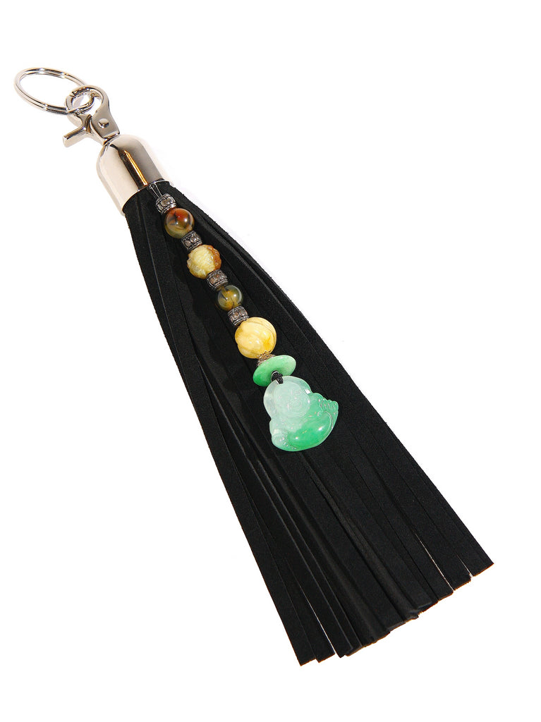 9 inch long black suede tassel purse charm key fob attached is string of beads with Buddha pendant jade and carnelian white background full view