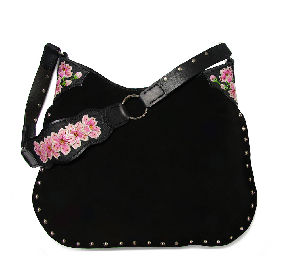 black suede studded handbag with hand tooled cherry blossom accent