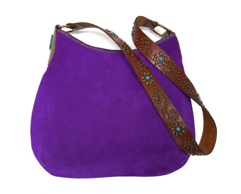 purple suede handbag with tooled leather peacock feather accent